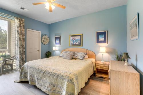 a bedroom with a bed and a ceiling fan at 4 Mi to Ocean Myrtle Beach Condo with Resort Perks in Myrtle Beach