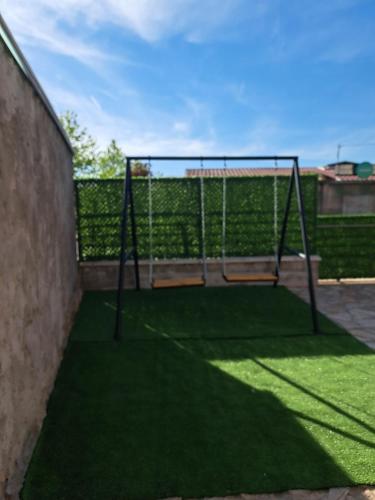 Zona de juegos infantil en Apartmani Manić