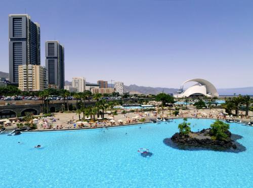 a large pool of water with people in a city at Holiday home in Santa Cruz de Tenerife