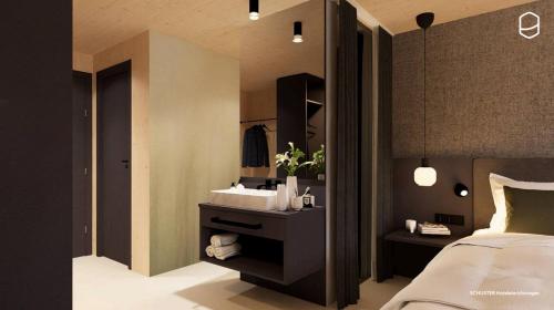 a bedroom with a bed and a sink in it at Roggenstock Lodge in Oberiberg