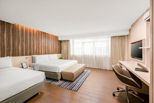 Katil atau katil-katil dalam bilik di Oasia Suites Kuala Lumpur by Far East Hospitality