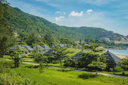 a view of a resort with a mountain at Crown Retreat Quy Nhon Resort in Quy Nhon
