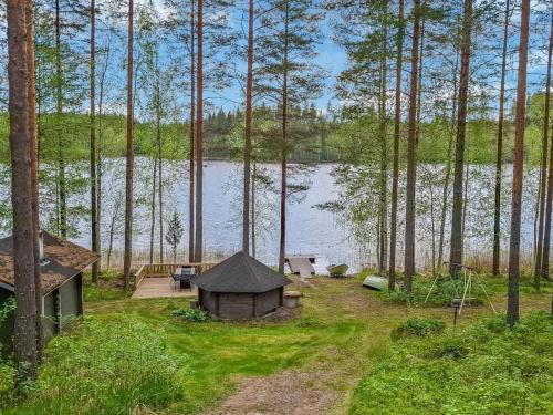 an aerial view of a cabin next to a lake at Holiday Home Mäntyrinne by Interhome in Ruottila