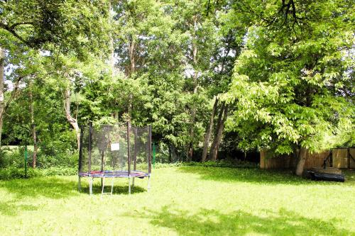 a chair sitting in the grass in a park at Chatka in Roztiezi in Roztěž