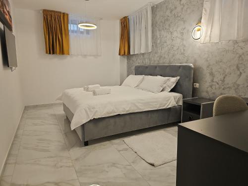 Ένα ή περισσότερα κρεβάτια σε δωμάτιο στο G&G Residence
