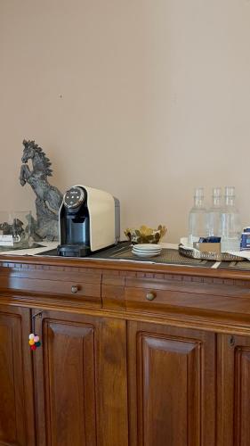 a wooden counter top with a toaster on top of it at Hotel Antica Stallera in Cannobio