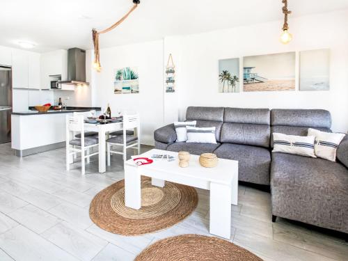 a living room with a couch and a table at Apartment Marina by Interhome in Salobreña