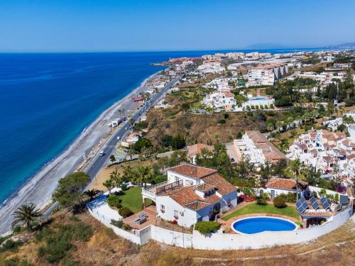 an aerial view of a house next to the beach at Villa Atardecer by Interhome in Torrox Costa