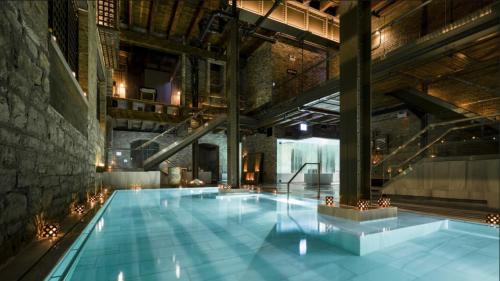 a large swimming pool in a large building at Art Downtown Fulton Market Entire 3 bedroom Home Sleep10 Private Garage Roof EV Tesla in Chicago