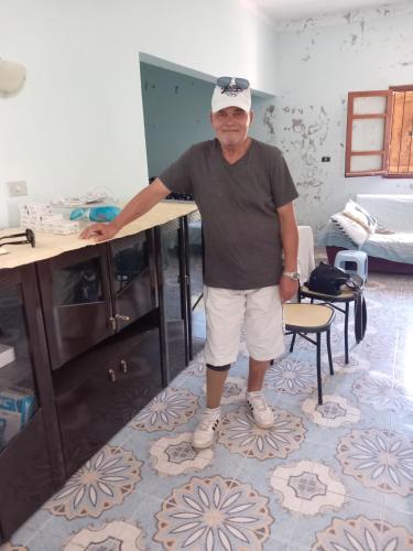 a man is standing next to a desk at Ita&tun in Tabarka