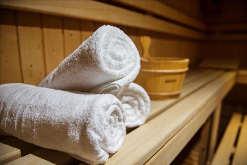 a stack of towels on a shelf in a sauna at 'A Nuciara Park Hotel & Spa in Furci Siculo