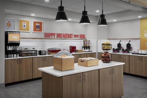 a kitchen with a counter with boxes of food at Hampton Inn Lenoir City in Lenoir City