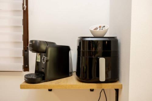 a coffee maker and a coffee pot on a shelf at El Silillo Burunchel in Cazorla