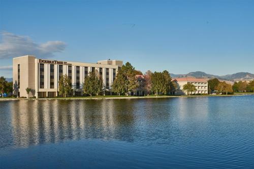 a large building next to a large body of water at DoubleTree by Hilton Hotel Salt Lake City Airport in Salt Lake City