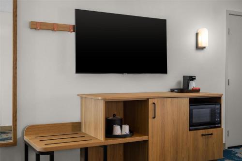 a flat screen tv hanging on a wall at Hampton Inn Miami-Airport West in Miami