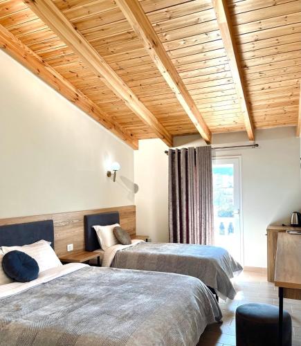 Postel nebo postele na pokoji v ubytování Mili Hotel