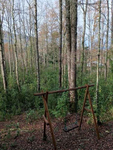 a wooden stand in the middle of a forest at David el roble3 in Caburgua