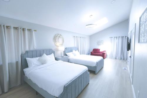 Ένα ή περισσότερα κρεβάτια σε δωμάτιο στο The Grand Vista Getaway