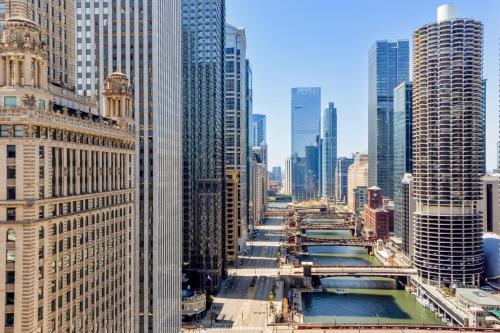 a view of a river in a city with tall buildings at Hilton Garden Inn Chicago Downtown Riverwalk in Chicago