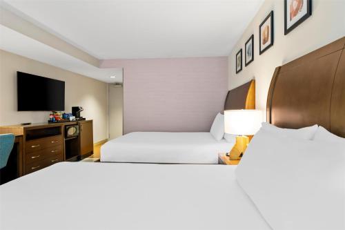 a hotel room with two beds and a tv at Hilton Garden Inn Chicago Downtown Riverwalk in Chicago