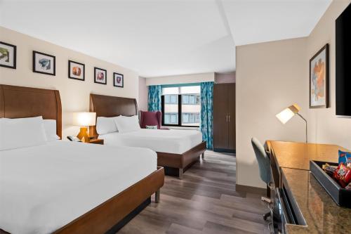 a hotel room with two beds and a desk at Hilton Garden Inn Chicago Downtown Riverwalk in Chicago