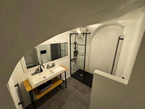 a bathroom with a sink and a shower at Hidden Hollow - Ultra Central in Braşov