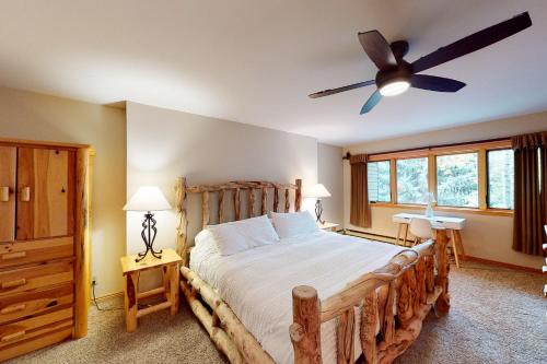a bedroom with a bed and a ceiling fan at Beaver Creek West 26 in Avon