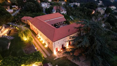 an overhead view of a building with a red roof at Chateau Du Comte 