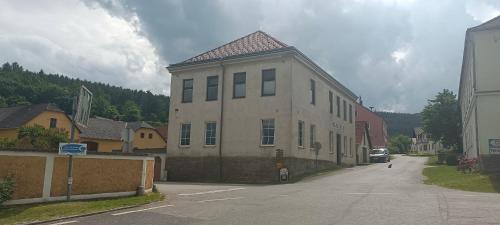 a large building on the side of a street at Frühstückspension Alte Volksschule Heinrichs bei Weitra in Heinreichs bei Weitra