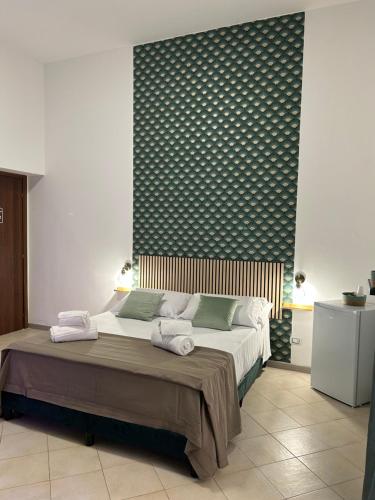 Postel nebo postele na pokoji v ubytování Florio Rooms