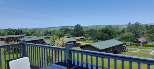 a balcony with a view of a group of houses at Lake view in Newquay