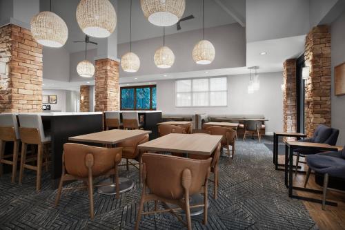 a restaurant with tables and chairs and lights at Homewood Suites by Hilton San Jose Airport-Silicon Valley in San Jose