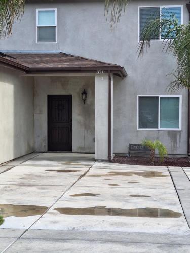 a house with a driveway in front of it at My amazing home in Azusa