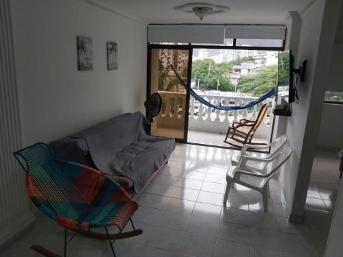 a living room with a couch and a chair at apartamento Santa Marta-Rodadero Blanquita301 in Santa Marta