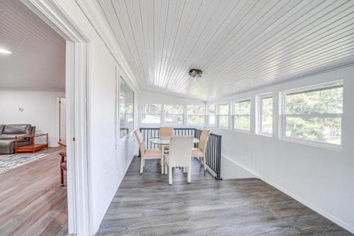 a dining room with a table and chairs at Waterfront Lake Eufaula Home Dock and Beach Access! in Texanna