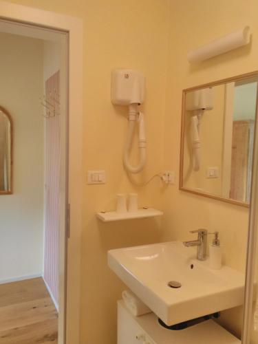 a bathroom with a sink and a mirror at Haus Tinkhauser in Vilpiano