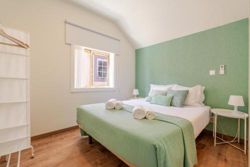 Postel nebo postele na pokoji v ubytování Petit Suites by PCALE