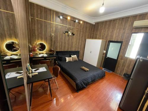 a bedroom with a bed and a desk in it at 17c dang van ngu 403 in Ho Chi Minh City