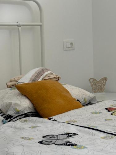 a bedroom with a bed with a white bedspread at Apartment JANG in Tolmin