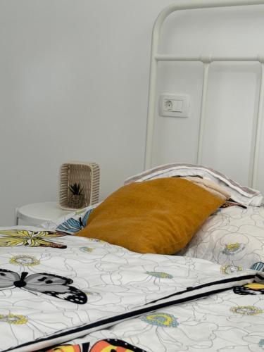 a bed with a pillow on it in a room at Apartment JANG in Tolmin