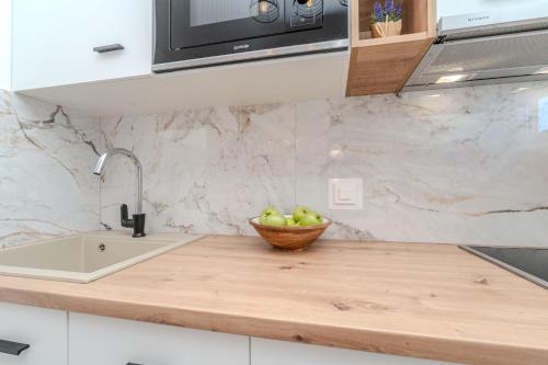 Kuchyň nebo kuchyňský kout v ubytování Apartments Bonex