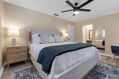 a bedroom with a bed and a ceiling fan at Pool & Play Oasis! All the Amenities & Near AMI! in Bradenton