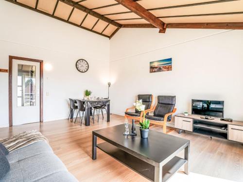 a living room with a couch and a table at Apartment Zeewind II A 11 by Interhome in Bredene