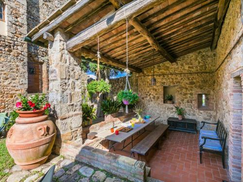 an outdoor patio with a table and a vase at Apartment La Torre-5 by Interhome in Stigliano
