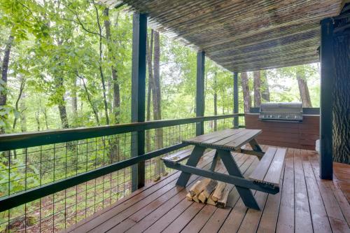 a picnic table on the deck of a cabin at Sapphire Valley Cabin with Private Mountain Views! in Sapphire
