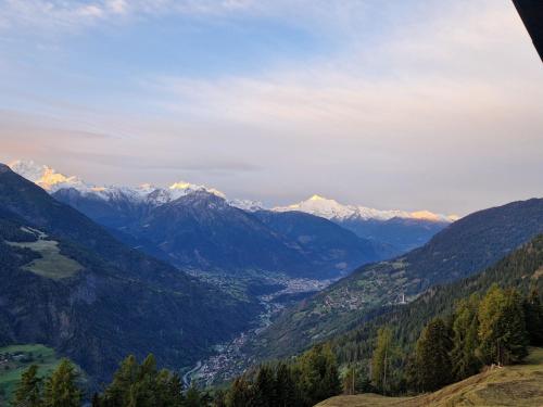 a view of a mountain valley with snow capped mountains at Apartment Egga 43 2- OG Süd by Interhome in Betten