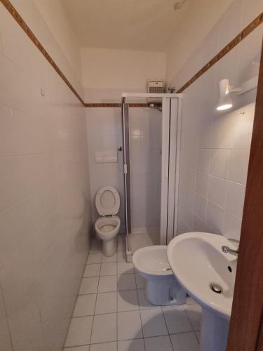 a bathroom with a toilet and a sink at Casa Alessia Taormina in Taormina