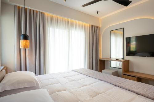Postel nebo postele na pokoji v ubytování Thalo "Aegean Touch Apartments"