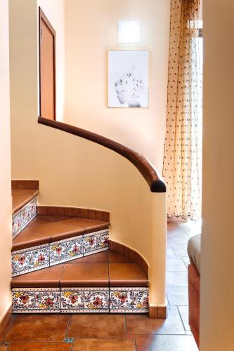 a staircase in a house with a mirror at casa Fontana in Capaci