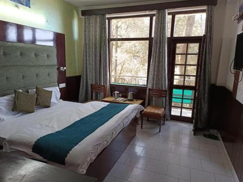 Katil atau katil-katil dalam bilik di Hoyel Ashiana Regency